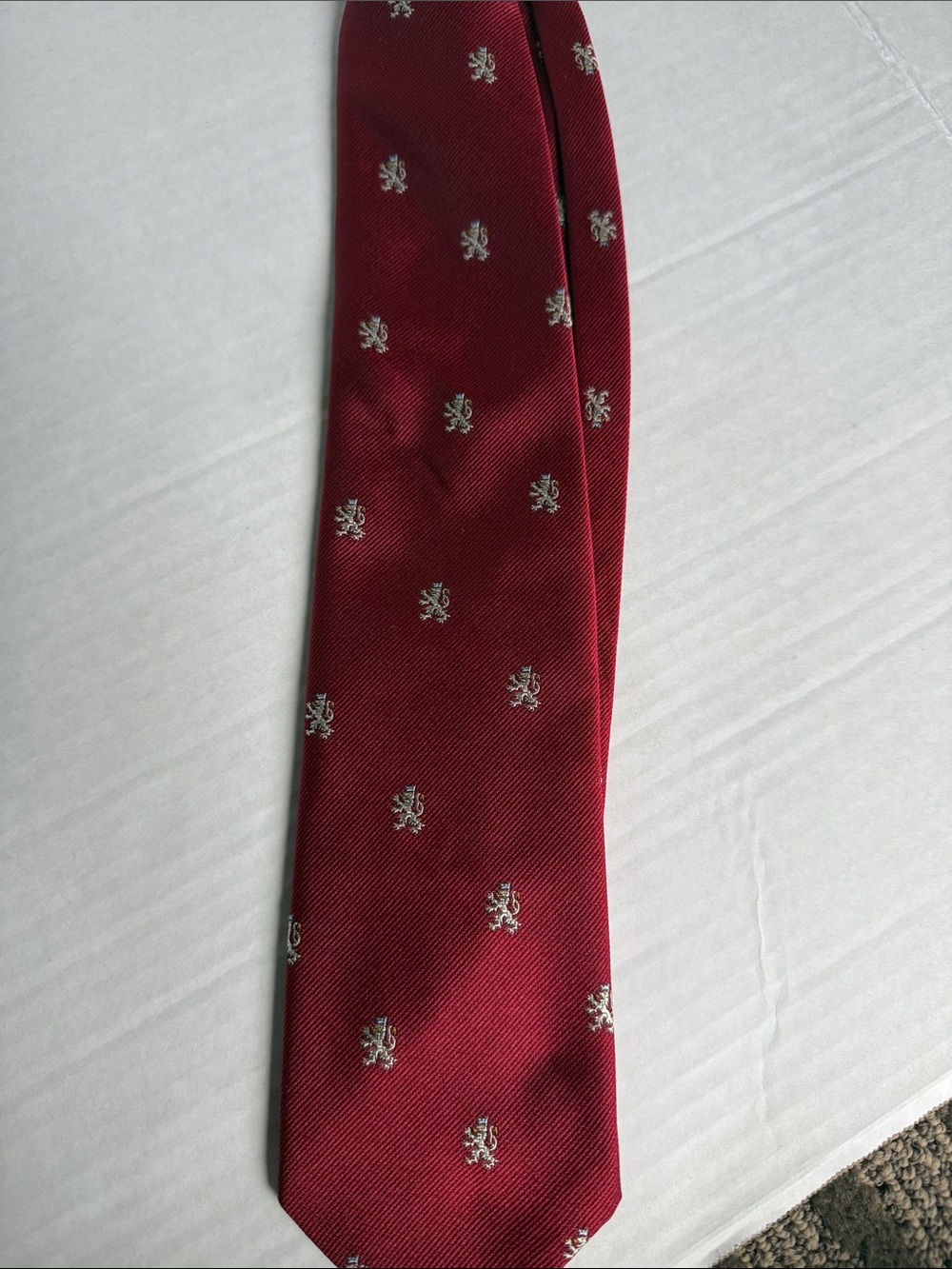Men's Burgundy Tie with Silver Crest Motif